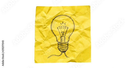 Foto Hand-drawn light bulb sketch on crumpled yellow paper representing innovation an