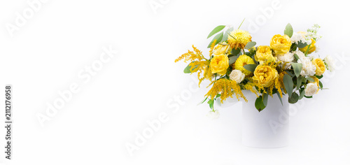Bouquet of yellow roses on a white background. Banner for greetings.
