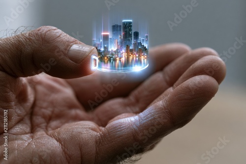 Hand holding a holographic cityscape projection