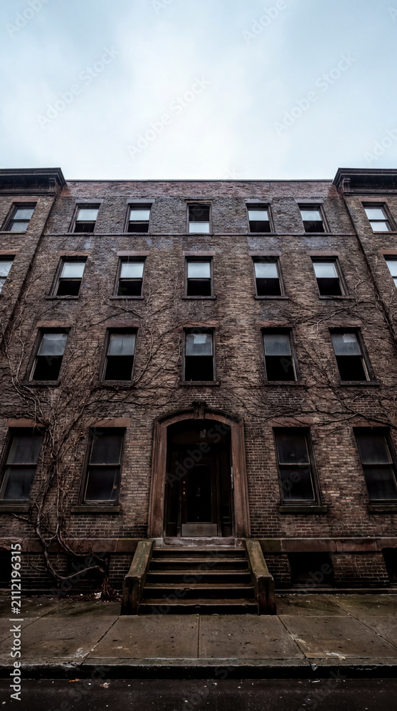Fototapeta premium Old Brick Apartment Building Entrance on Quiet Rainy Urban Street