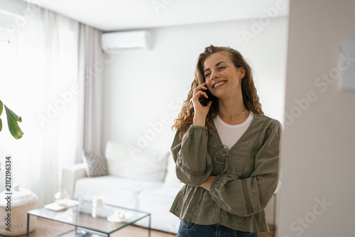 Beautiful woman on a phone call talking cheerfully