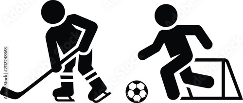Goalkeeper diving to save soccer ball while player kicks at goal