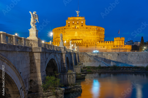 Ponte Sant Angelo (Bridge of Angels), Castel Sant'Angelo and Tiber river at night, Rome, Italy. Famous historical landmark.