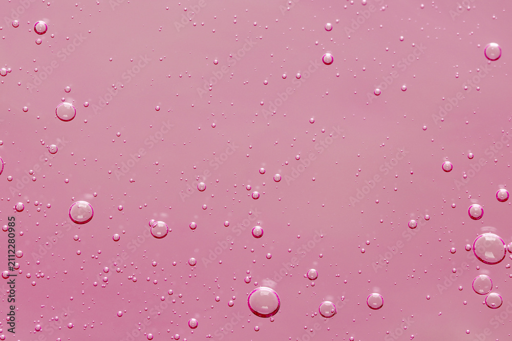 Obraz premium Pink transparent cosmetic product as background, closeup