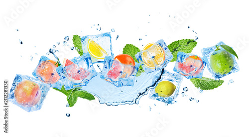 фотографія Fresh citrus fruits in ice cubes and water splash in air on white background