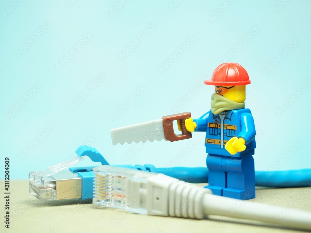 Fototapeta premium Indonesia - September 15, 2023 : Mini toy at table with blurred background. Network engineer concept design.