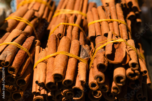 View of tied bundles of cinnamon sticks on market stall