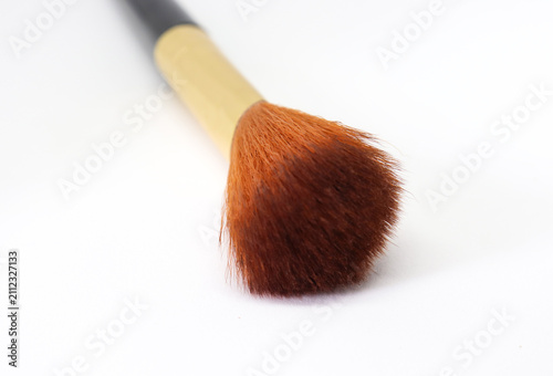 Bild auf Leinwand Close up shows a professional powder makeup brush against a white backdrop