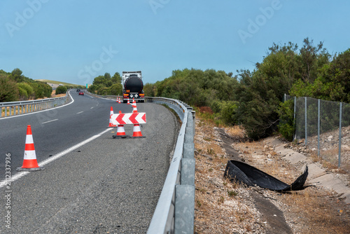 Debris from a tire on the road after a truck tire blowout.