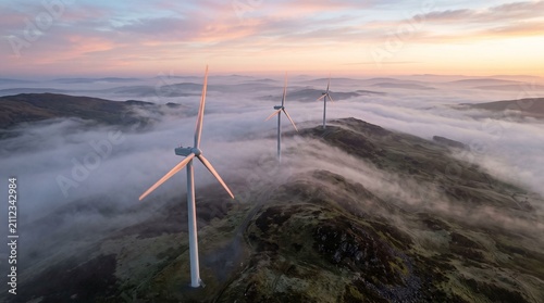 Foto Aerial view of wind turbines at dawn