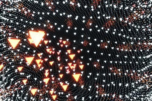 Orange geometric triangle particle wave background. Abstract dynamic glowing particle light explosion.
