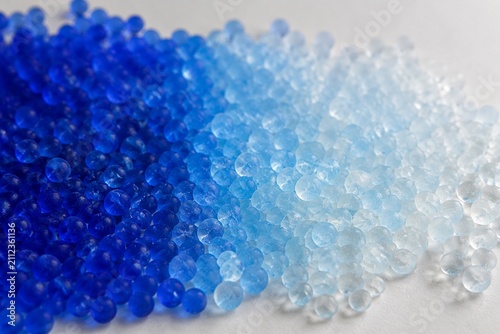 Blue desiccant beads color transition, from moist to dry state.