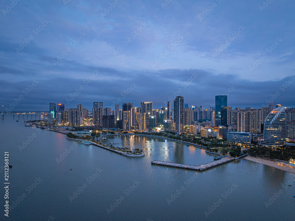 Obraz premium Zhanjiang Jinshawan bay night view with city skyline and waterfront architecture