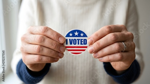 Closeup of a person holding an i voted sticker isolated on white background