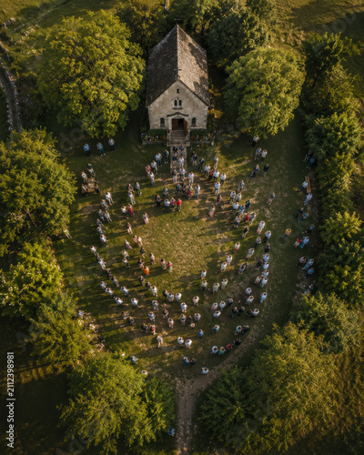 Christianity Seen From Above – Christian Community Gathered Around a Rural Chapel, Symbolic Aerial View of Unity, Faith and Fellowship