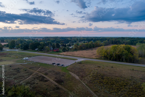 Rural landscape at twilight featuring fields and Crandell Lake parking lot