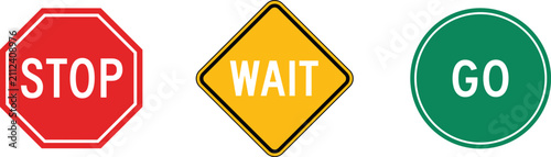 Foto Three clear signs: red stop octagon, yellow wait diamond, and green go circle, p