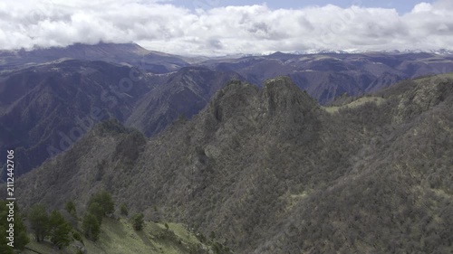 A drone video of the Caucasus Mountains, the Dzhily‑Su Valley, and the Pkhia Pass, Arkhyz, Russia, 2026.

