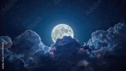 Bright full moon illuminating night sky with clouds and stars.