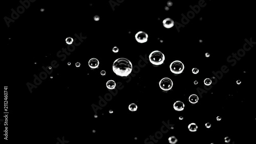 Crystalline water droplets on black background, macro liquid spheres with high contrast reflections, clear condensation beads for overlay textures