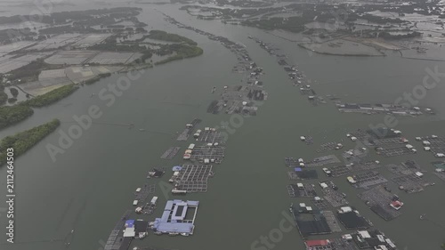 Aerial drone footage of oyster farming in Long Son, Ho Chi Minh City, Vietnam, showcasing traditional aquaculture, floating oyster farms, coastal fishing industry and sustainable seafood production.