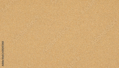 Closeup texture of a light brown cork material and golden sand texture background