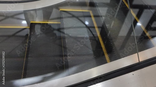 Close up view of moving escalator steps inside a clean contemporary building