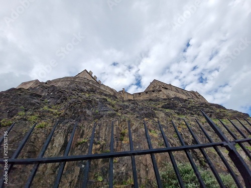 Edinburgh Castle on top of a rocky hill in Edinburgh, Scotland