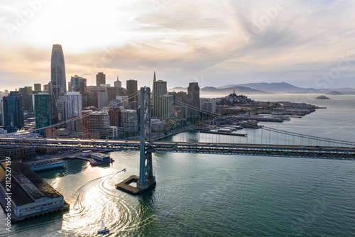 Bild auf Leinwand San Francisco Bay Bridge with city skyline at dusk