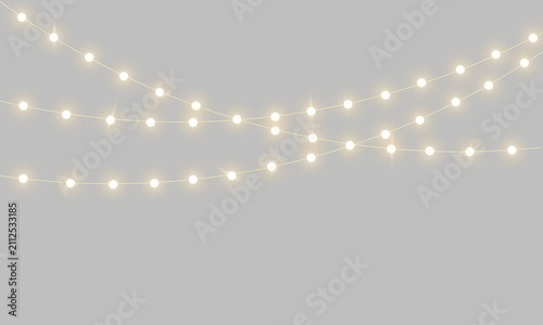 Fotografie Realistic warm glowing string lights or Christmas fairy light garland overlay wi