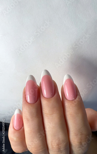 Elegant Pink French Manicure on Almond Shaped Nails Close Up