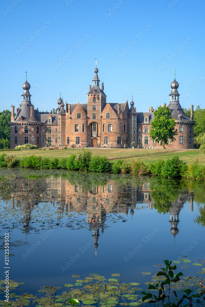 Obraz premium Ooidonk Castle / Kasteel van Ooidonk, 16th century Flemish Renaissance moated castle at Sint-Maria-Leerne in summer, Deinze, East Flanders, Belgium
