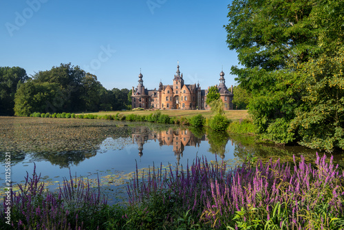 Ooidonk Castle / Kasteel van Ooidonk, 16th century Flemish Renaissance moated castle at Sint-Maria-Leerne in summer, Deinze, East Flanders, Belgium