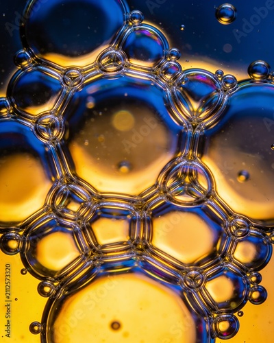 Abstract macro close up of soap bubbles creating a colorful geometric pattern of light