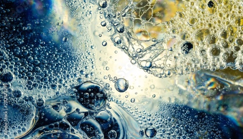 Abstract macro shot of soap bubble textures mixing with oil creating colorful patterns