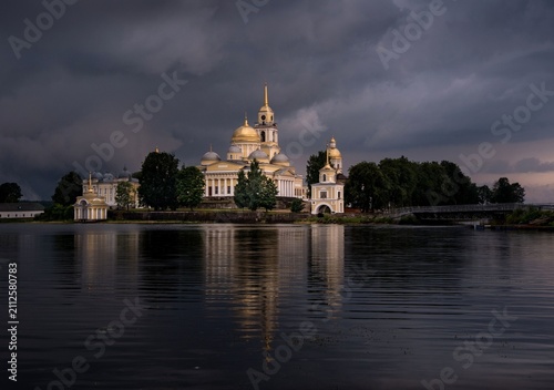 Cathedral with Golden Domes on Island in Lake Under Stormy Sky