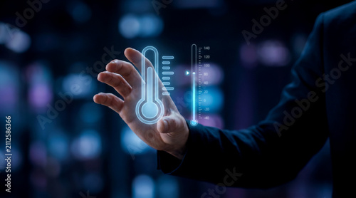 Business professional interacting with digital temperature control interface in dark virtual environment