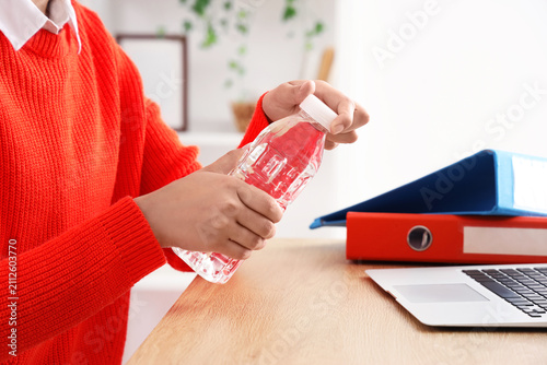 Person in red sweater openi...