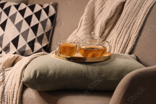 Glass teapot and cup of hot...
