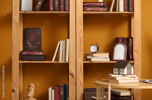 Bookshelf with books and de...
