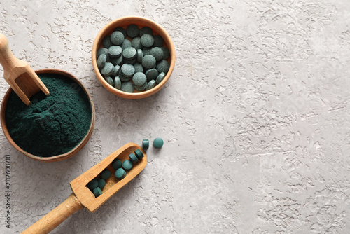 Bowls of spirulina powder a...