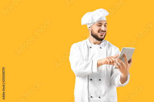 Male chef using tablet comp...