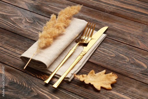 Stylish golden cutlery with...