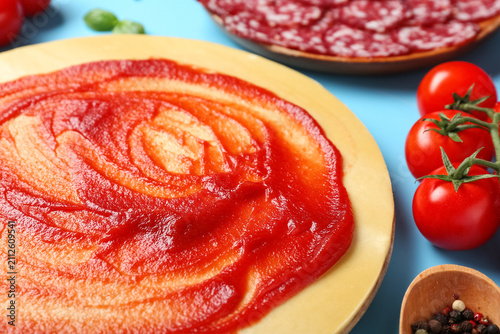 Pizza dough with tasty toma...