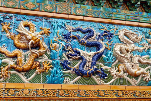 Golden Chinese Dragon Wall Sculpture at Chicago's chinatown with Gold Religious Architecture and Traditional Buddhist Art Details