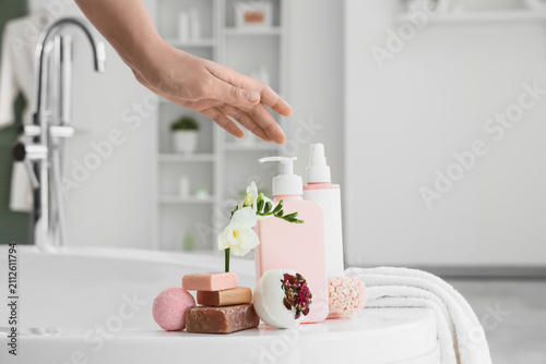 Female hand with bath bombs...