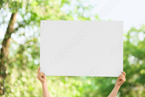 Female hands holding blank ...