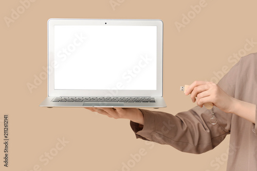 Young woman holding modern ...