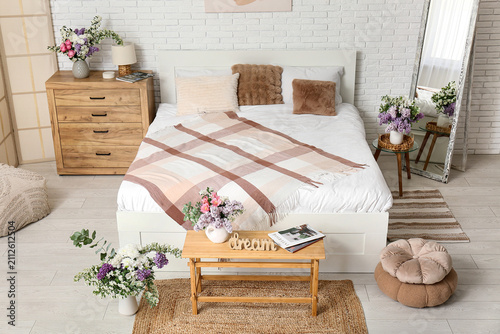 Interior of light bedroom w...