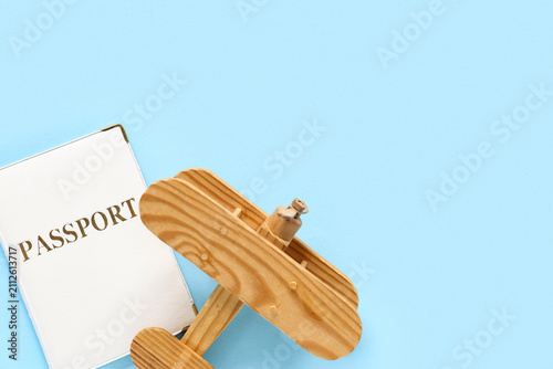 Passport and wooden plane o...